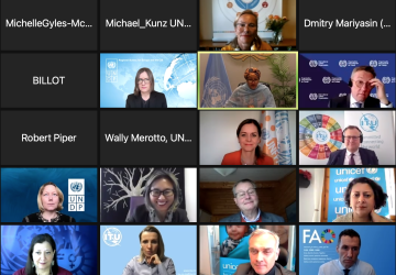 Screenshot of a virtual Zoom meeting shows 16 squares, each with either someone's name or face.