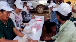 Staff at the Centre for Malaria Prevention and Eradication perform Rapid Diagnostic Tests for malaria. 