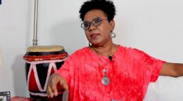 Singer Xiomara Fortuna elegantly poses in front of her congos as she shares how music is so important. 