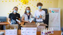 Youth volunteers organize supplies for distribution.