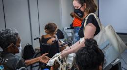 Training course staff provide participants a tote bag. 