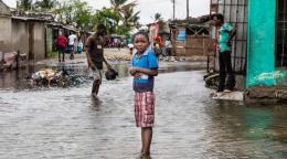 A child stands in rising water in the neighbourhood of Praia Nova in Beira, Mozambique. 