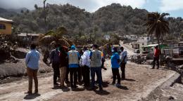 UN officials survey the aftermath of the volcanic eruption. 
