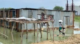 A home surrounded by flood water. 