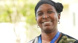 Portrait of a smiling woman looking at the camera.