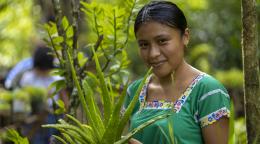 A young woman in a garden.
