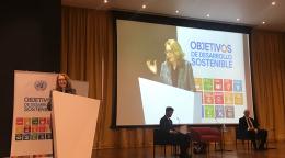 Allegra Baiocchi, United Nations Resident Coordinator in Costa Rica, standing at a podium in front of a microphone during an event.