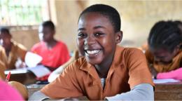 Young boy sitting in a school in Cameroon