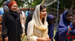 UN Deputy chief and Malala Yousafzai appear to be walking at an event