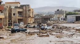 An image of a flooded urban area, with buildings partially submerged.