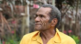 Michael Butuhe, retired primary-level teacher and head of the village business group.