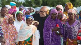 United Nations Resident Coordinator in Ghana Charles Abani, with a group of asylum seekers 