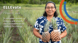 A woman in a blue colourful shirt with a graphic