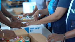 Humanitarians prepare food ration kits after a hurricane made landfall in Jamaica.