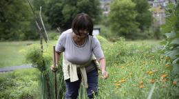 A woman farmer in Montenegro works in her field.