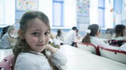 A young girl in Georgia sits in a classroom.
