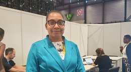 A woman engineer at a conference.