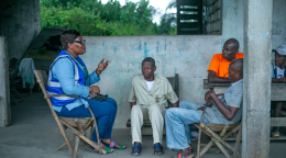 A UN Volunteer in Gabon speaks to local community members.