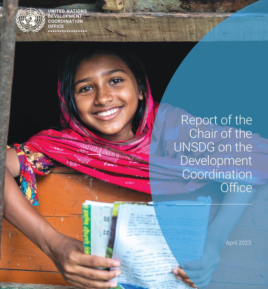 Girl in pink dress holding a book