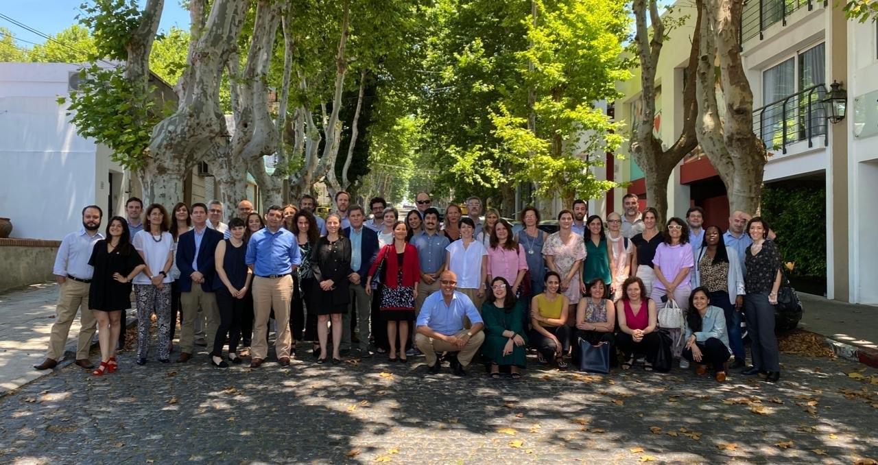 Photo shows the UN Teams from Argentina and Uruguay posing in front of a tree.