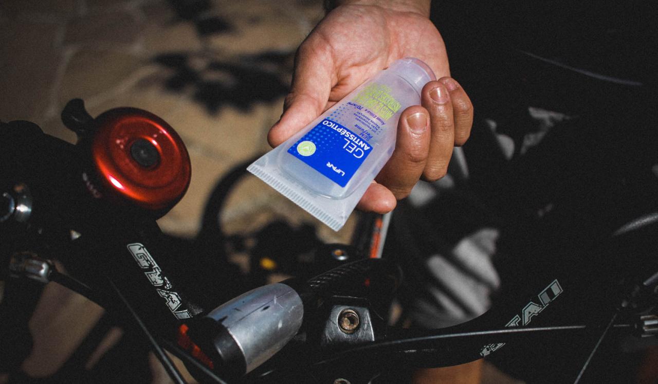 Matheus Martinez, 27, holds the hand sanitizer he carries with him on deliveries.