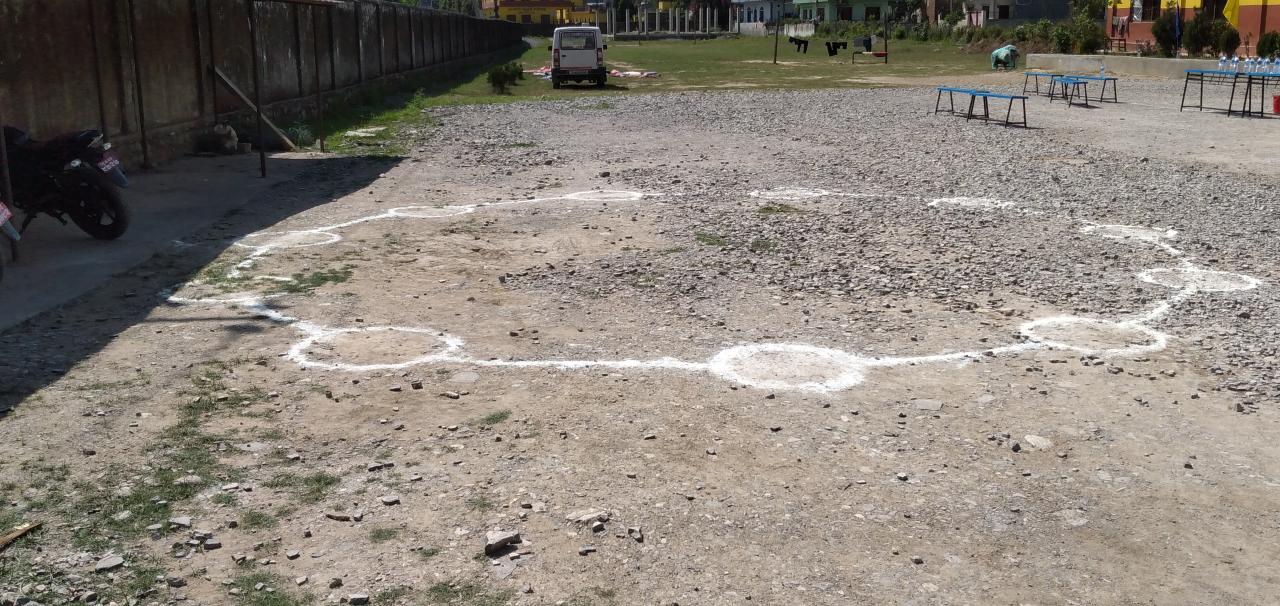 Circles drawn on the ground to help health workers maintain a distance from one another at a quarantine center in Rupandehi District in Nepal’s west. UNICEF, together with the government and other partners, has been part of visits to different quarantine centres such as this one to assess conditions, with a focus on water, sanitation and hygiene facilities and protection issues. 