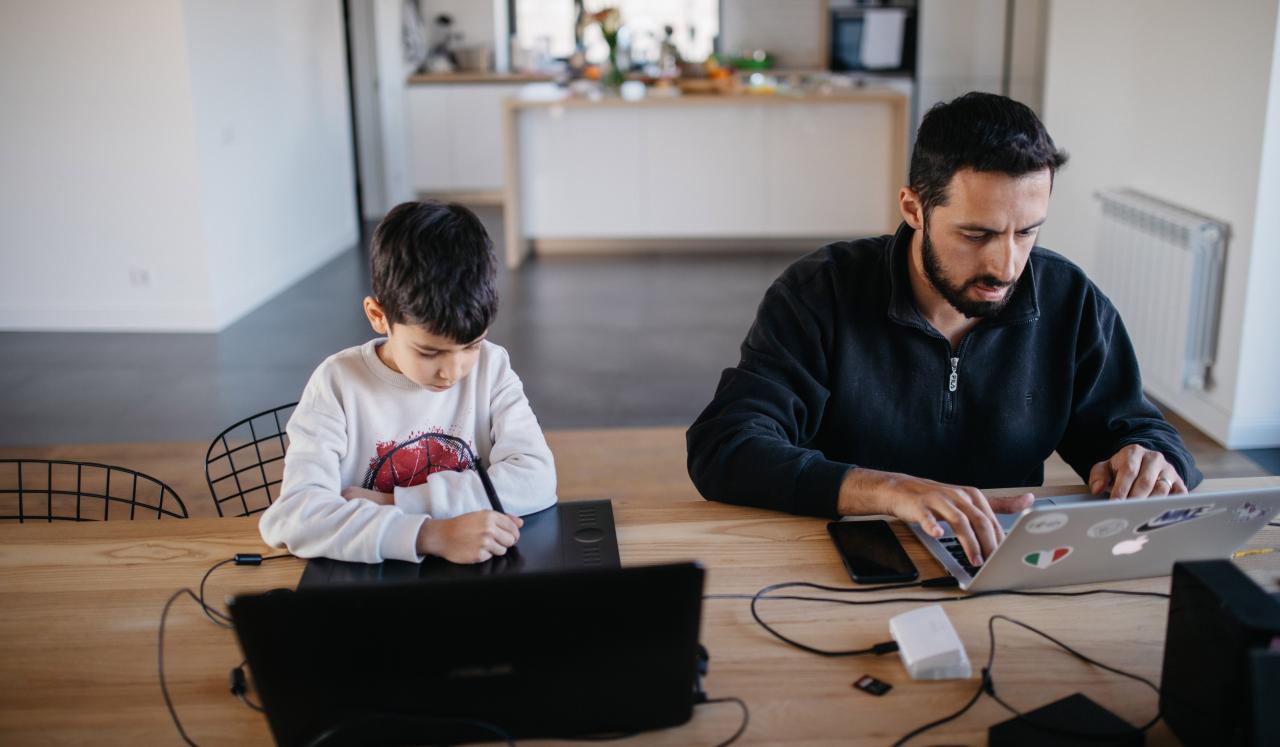  In Yerevan in Armenia, Danny, age seven, sits at a computer as his Arthur Gevorgyan works.