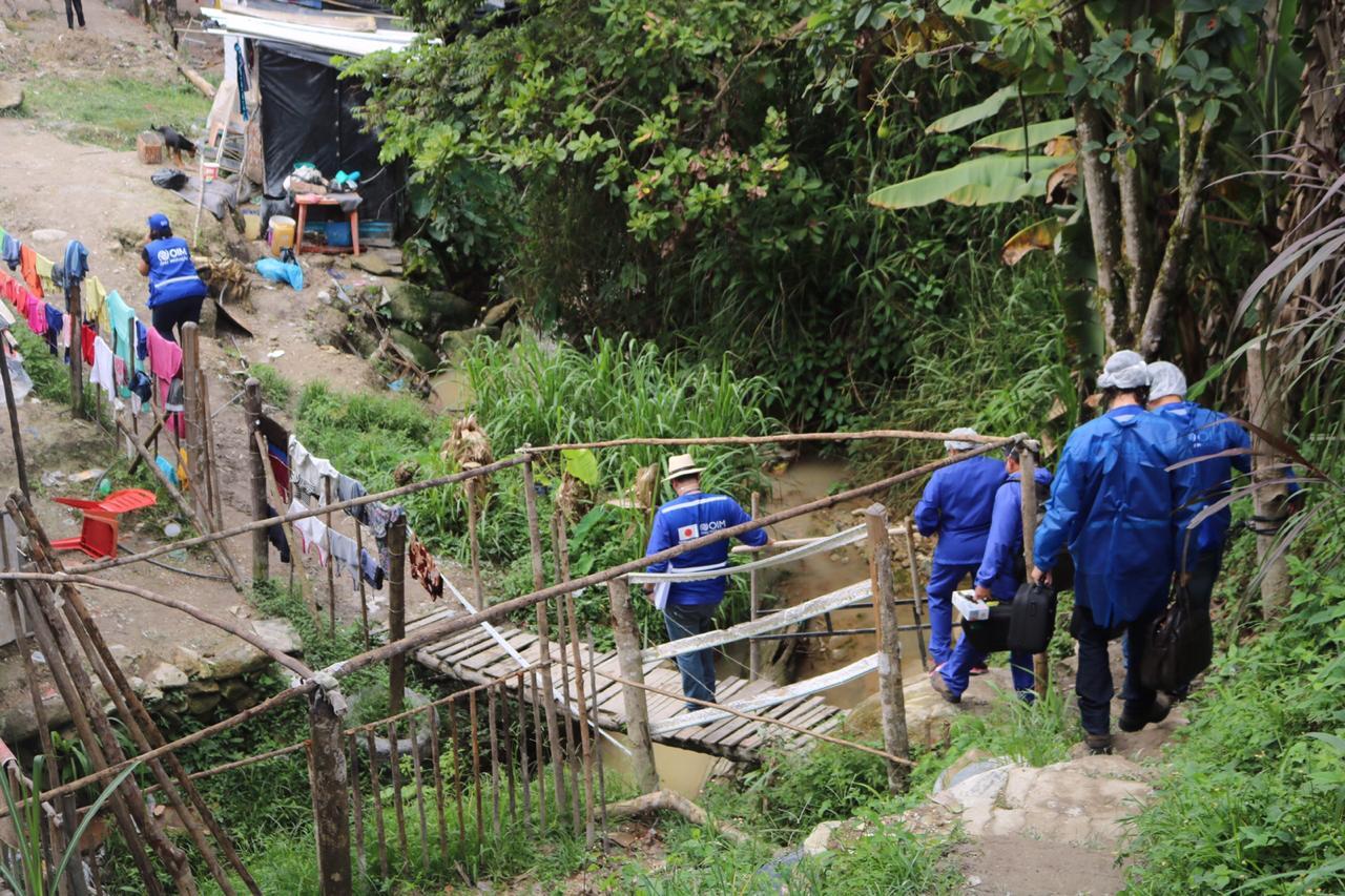 UN staff walk down to meet families in the most remote areas of Brazil.