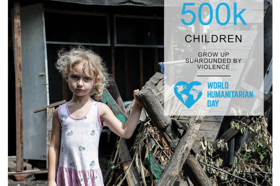 A little girl with a serious expression stands outside a home. A factoid to the right reads 500k children grow up surrounded by violence.