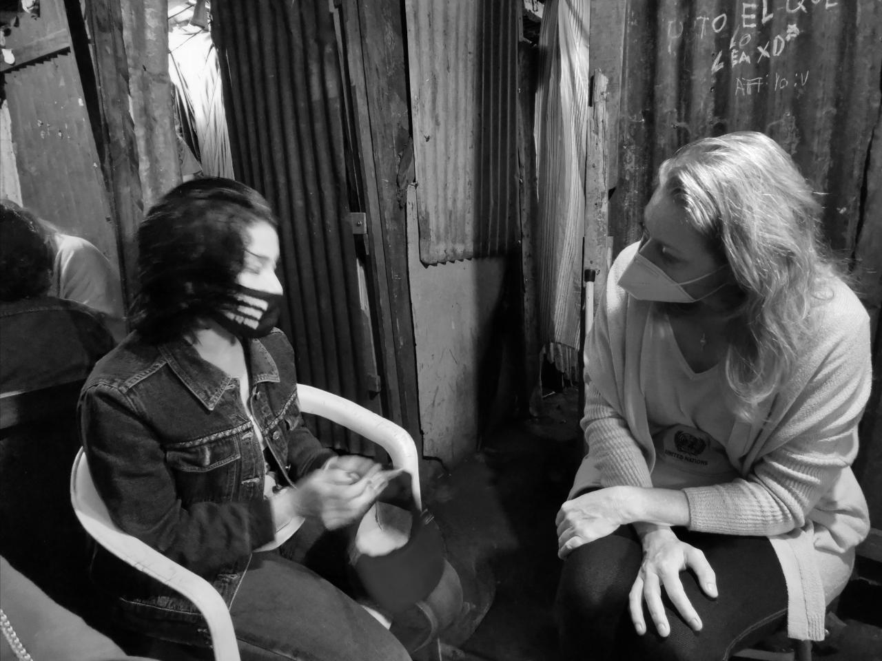 Lilith sits with Resident Coordinator Allegra Baiocchi.