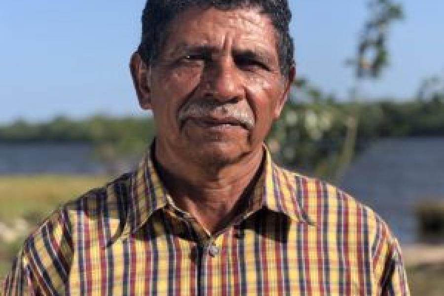 Electerio Colomer, business owner looks stoically at the camera.