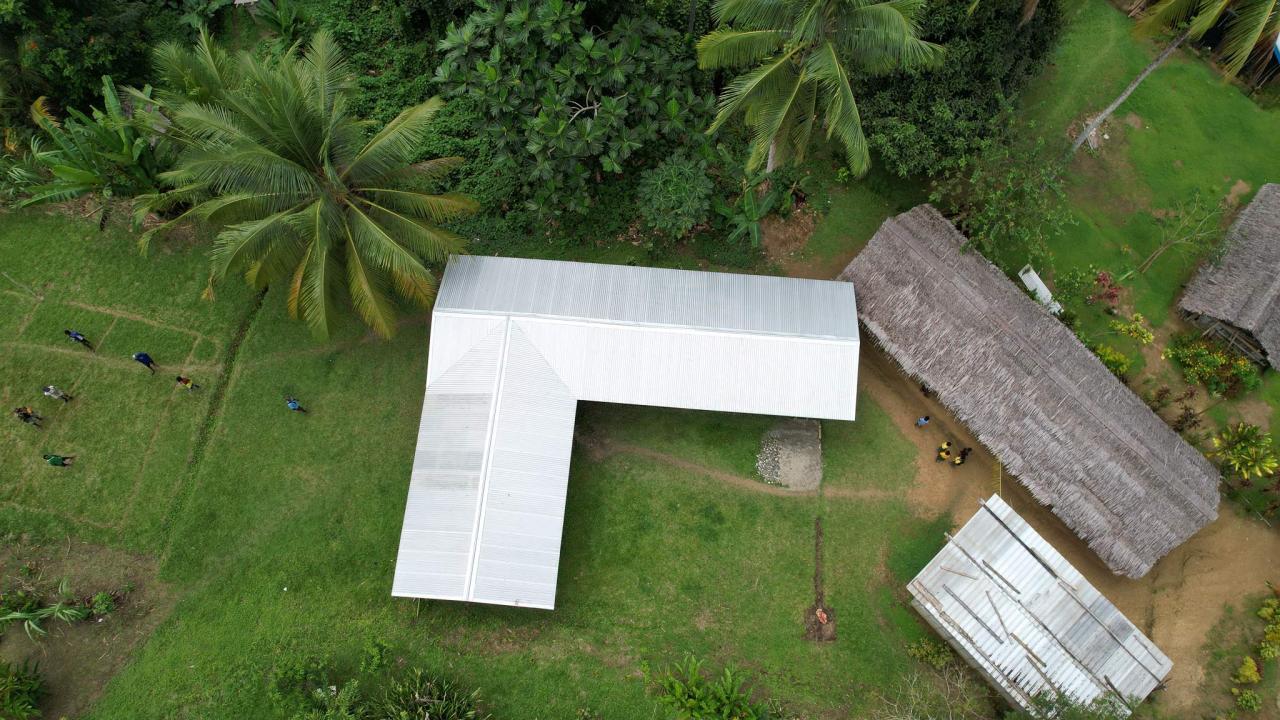 The new permanent-structure elementary classroom built by the Hambini villagers, replacing the old space for children's education. 