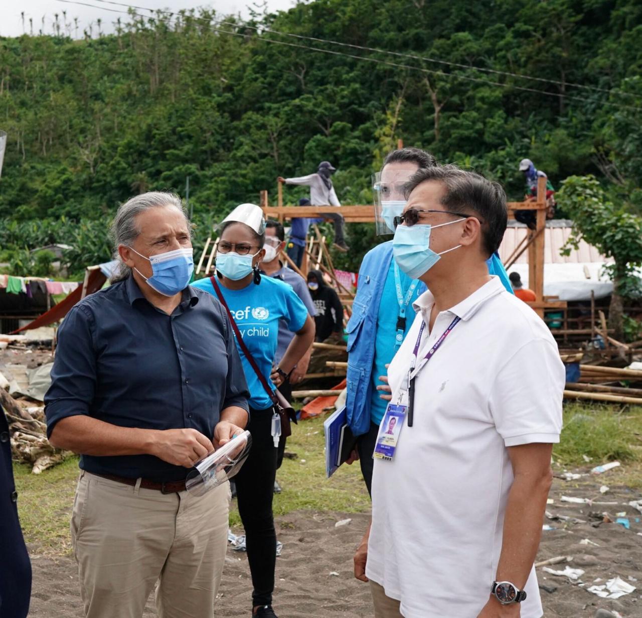 The UN Resident Coordinator in the Philippines, Gustavo González, visits a community affected by Typhoon Rai which struck the country in December 2021. 