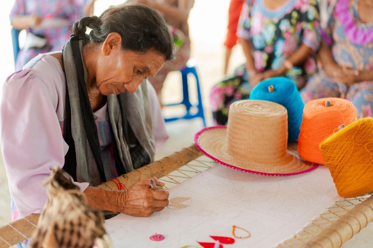 Flor Fuenmayor (52), creates designs at the Yarn Cone Bank 