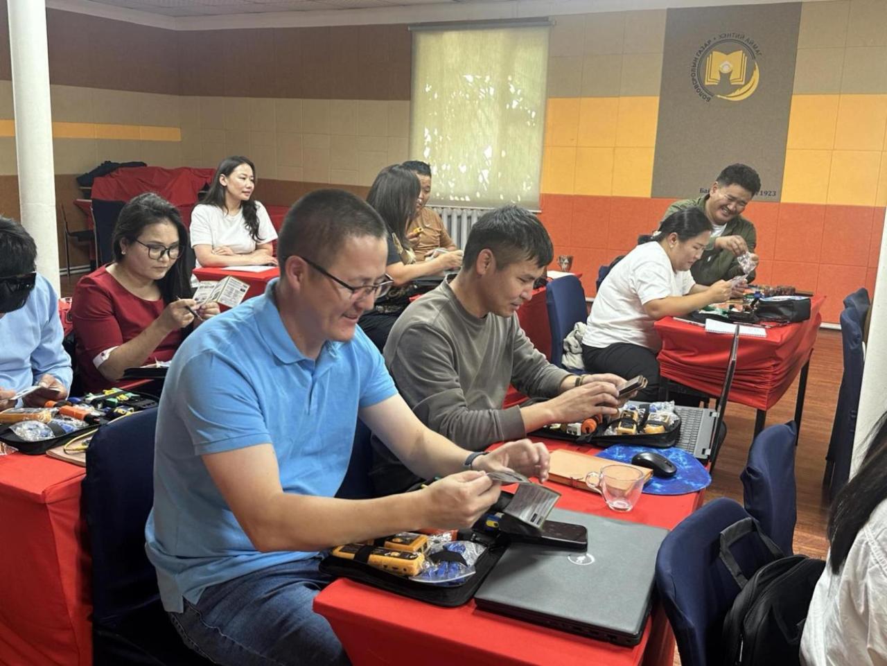 Teachers receiving hands-on training on using network cable in Khentii province