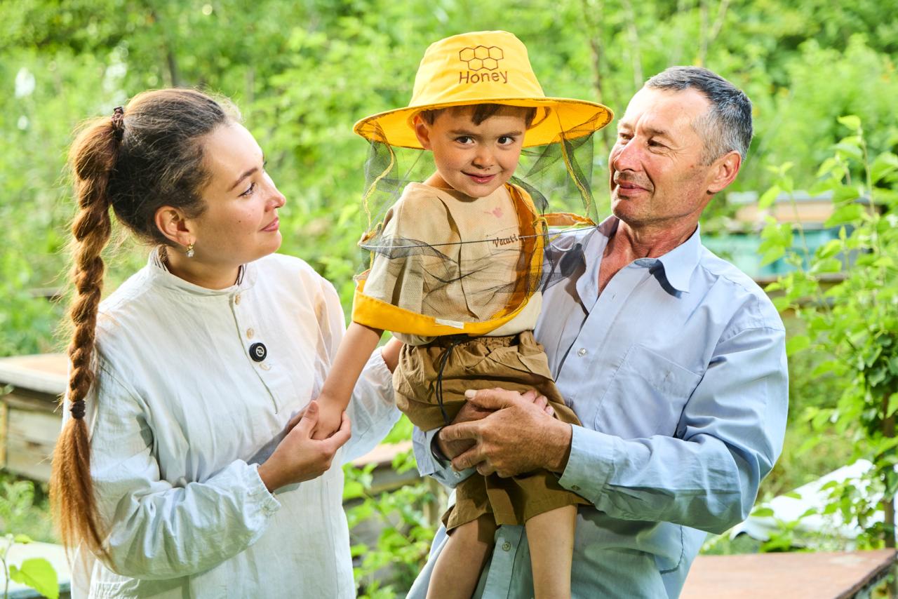 An Uzbek family consisting of a mother, father and young son.
