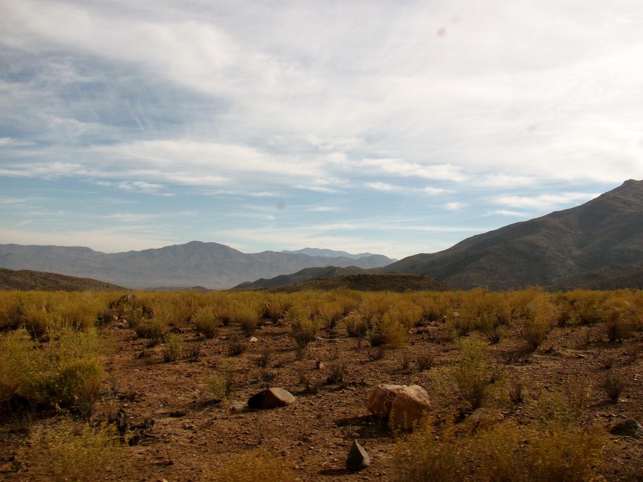 Landscape in Chile with fertile land and mountains in the background.