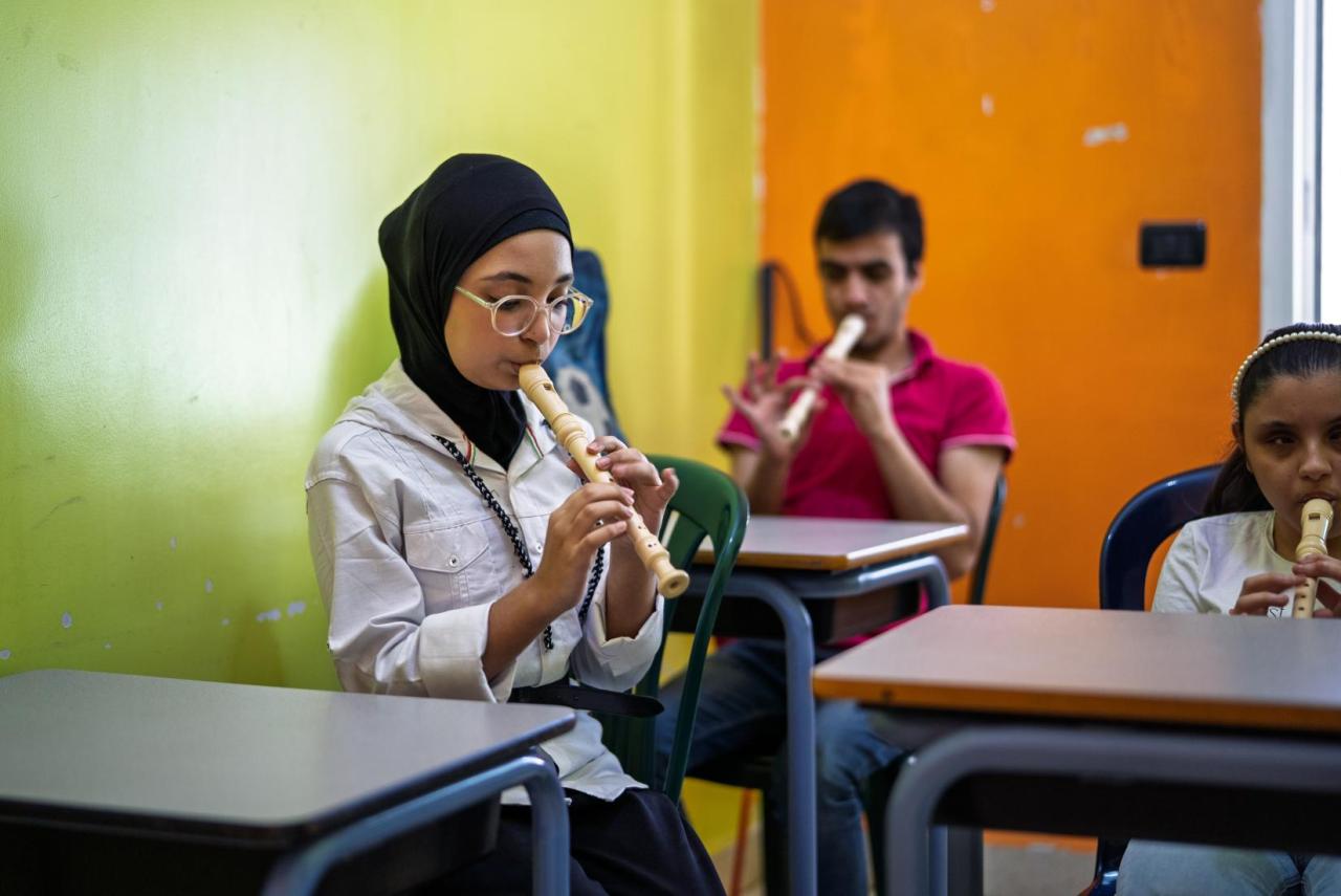 A young Lebanese girl plays the flute