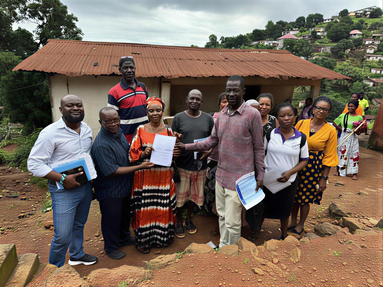 A group of people pose for a photo in Freetown, Sierra Leone.