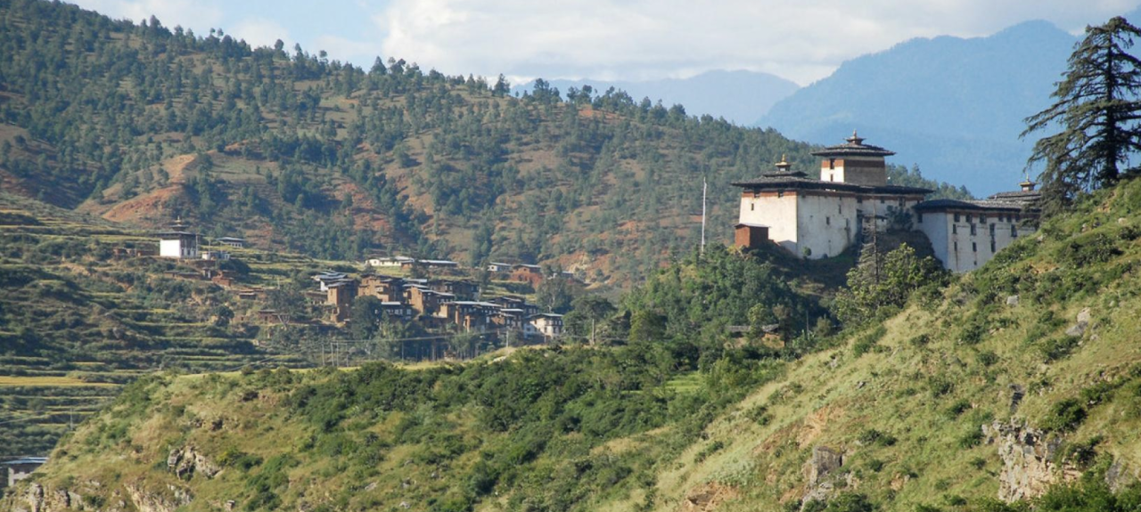 A landscape view of a remote village in a mountainous region. 