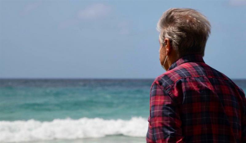 The Secretary General of the United Nations looks out onto the ocean. 