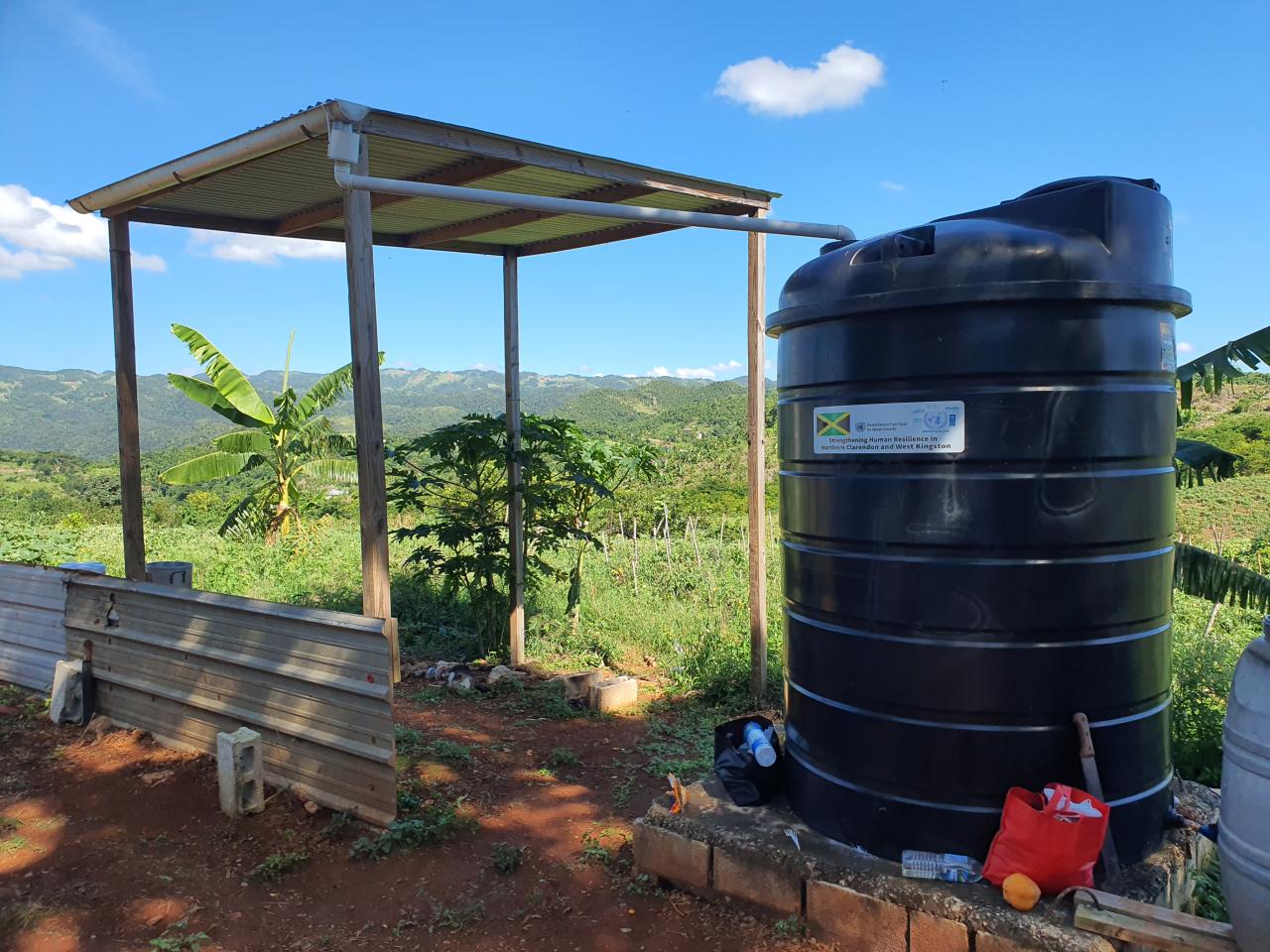 A two-store shed and a water tank.