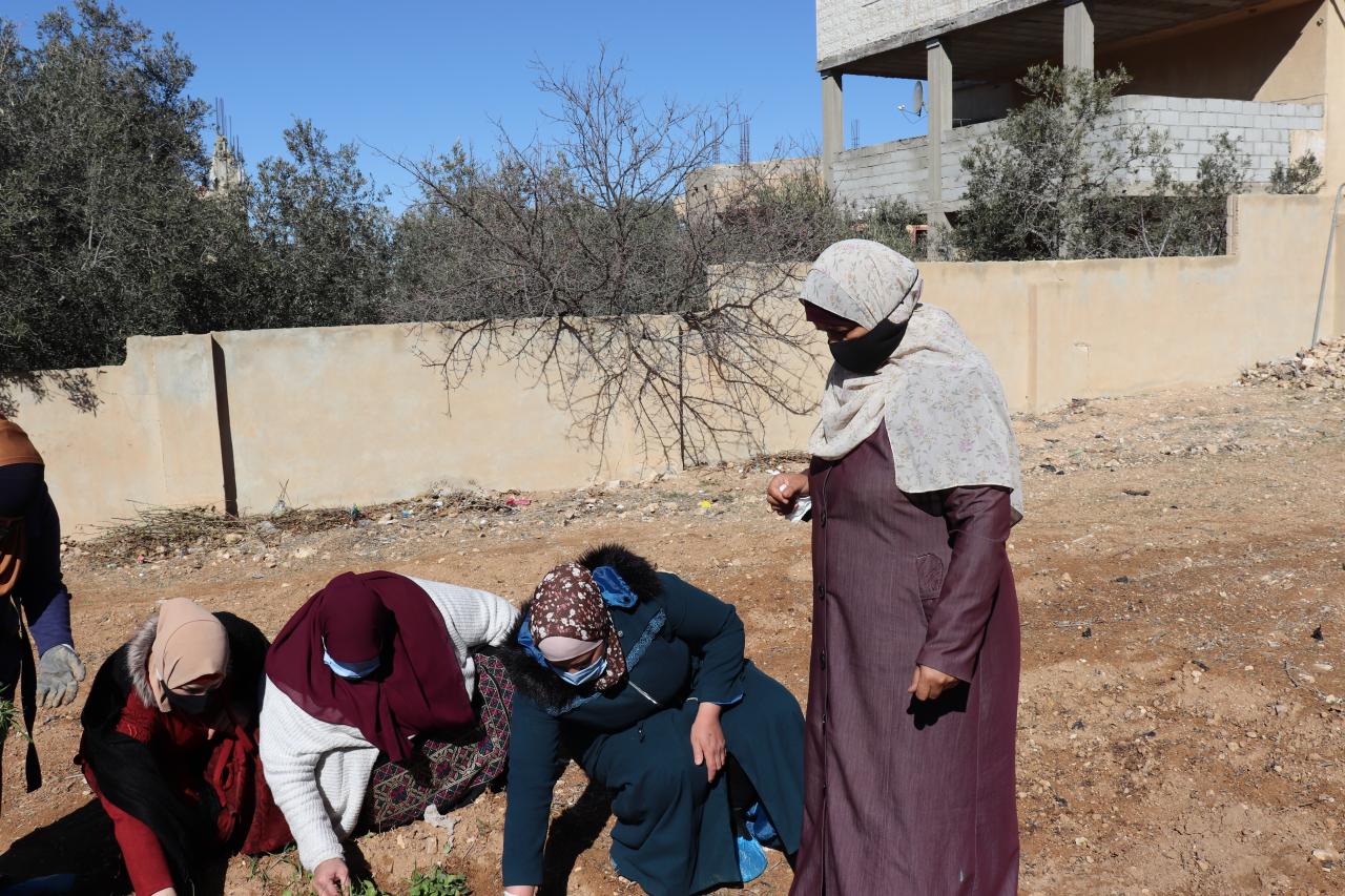 Aida Salameh, agriculture trainer, overseeing trainees during a practical training session.