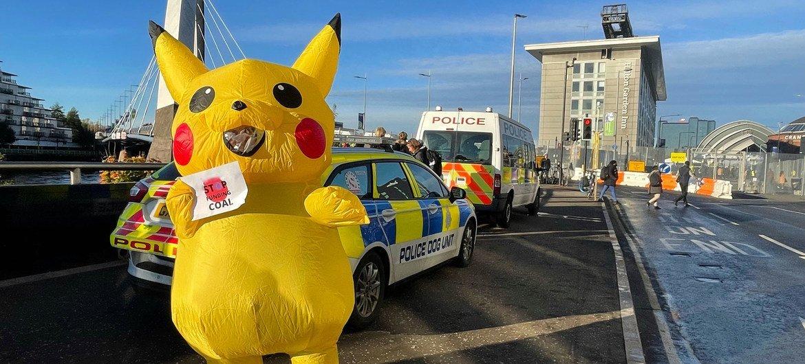 An activist dressed as Pikachu demonstrates outside COP26, the UN Climate Conference, taking place in Glasgow, Scotland.