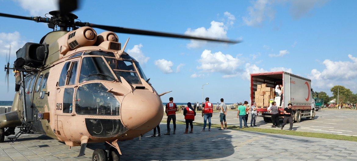 Helicopter with emergency supplies on the tarmac