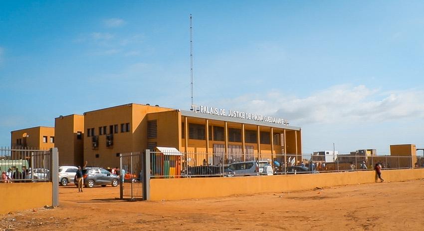 A photo of a courthouse building painted in yellow or orange paint.