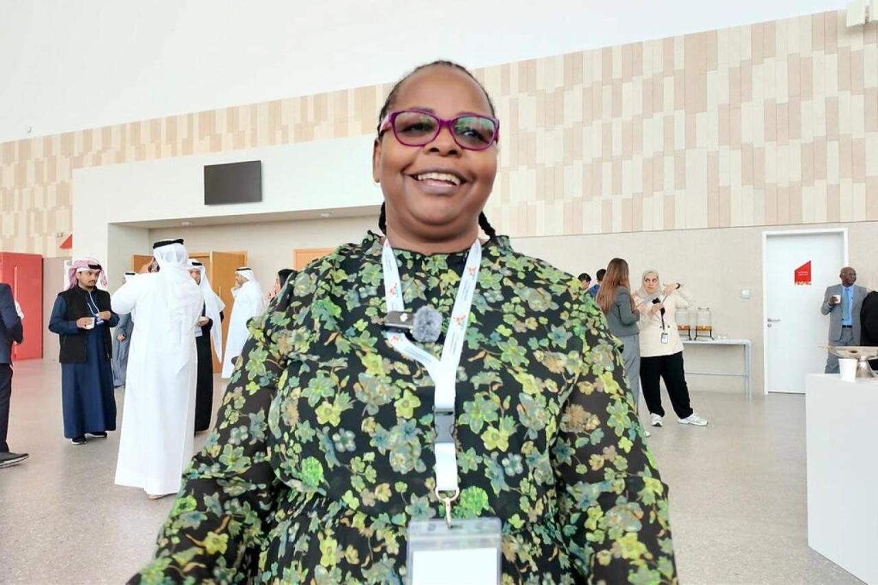 A woman participates in a conference 