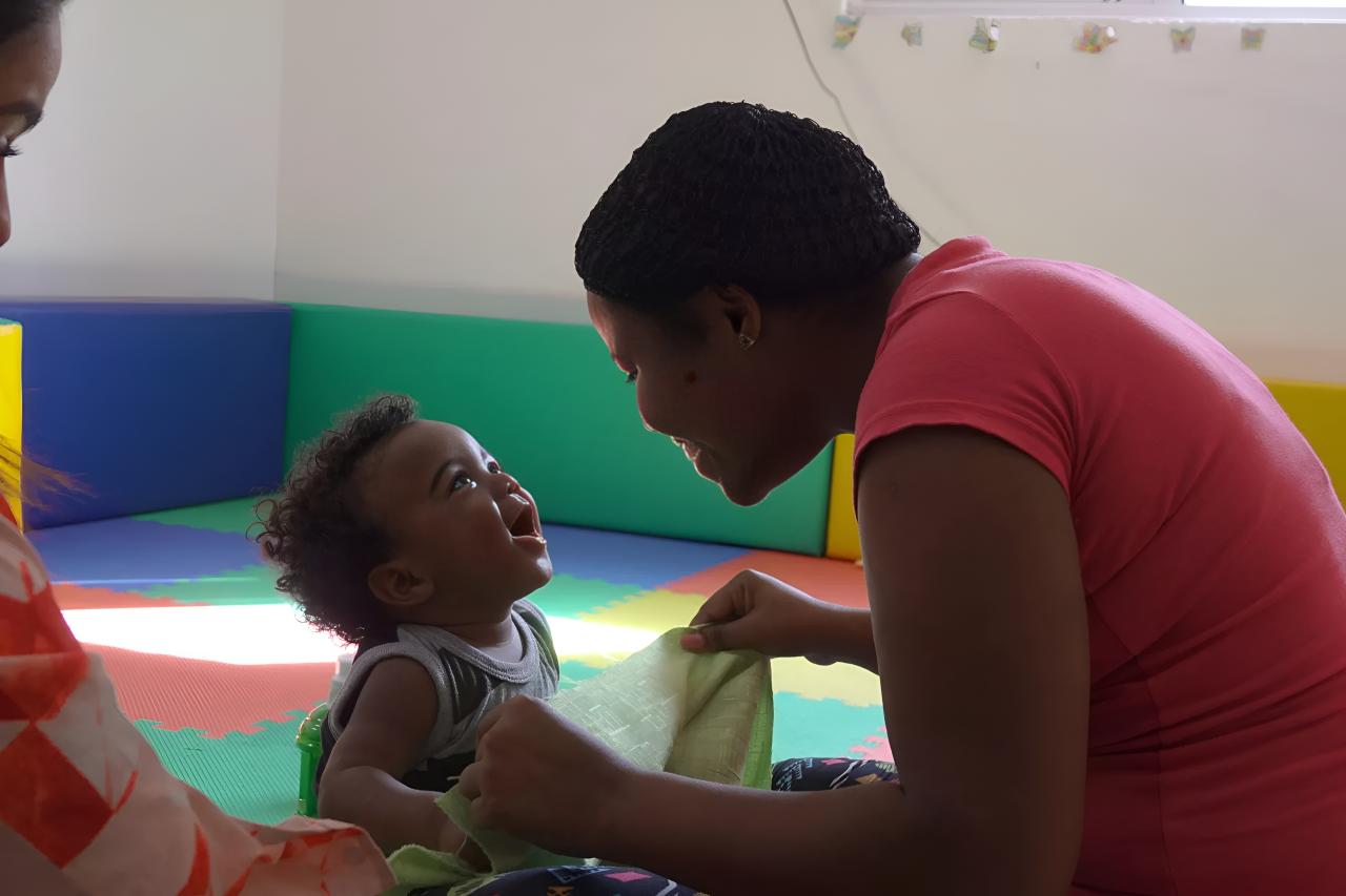 A woman in the Dominican Republic with her baby.