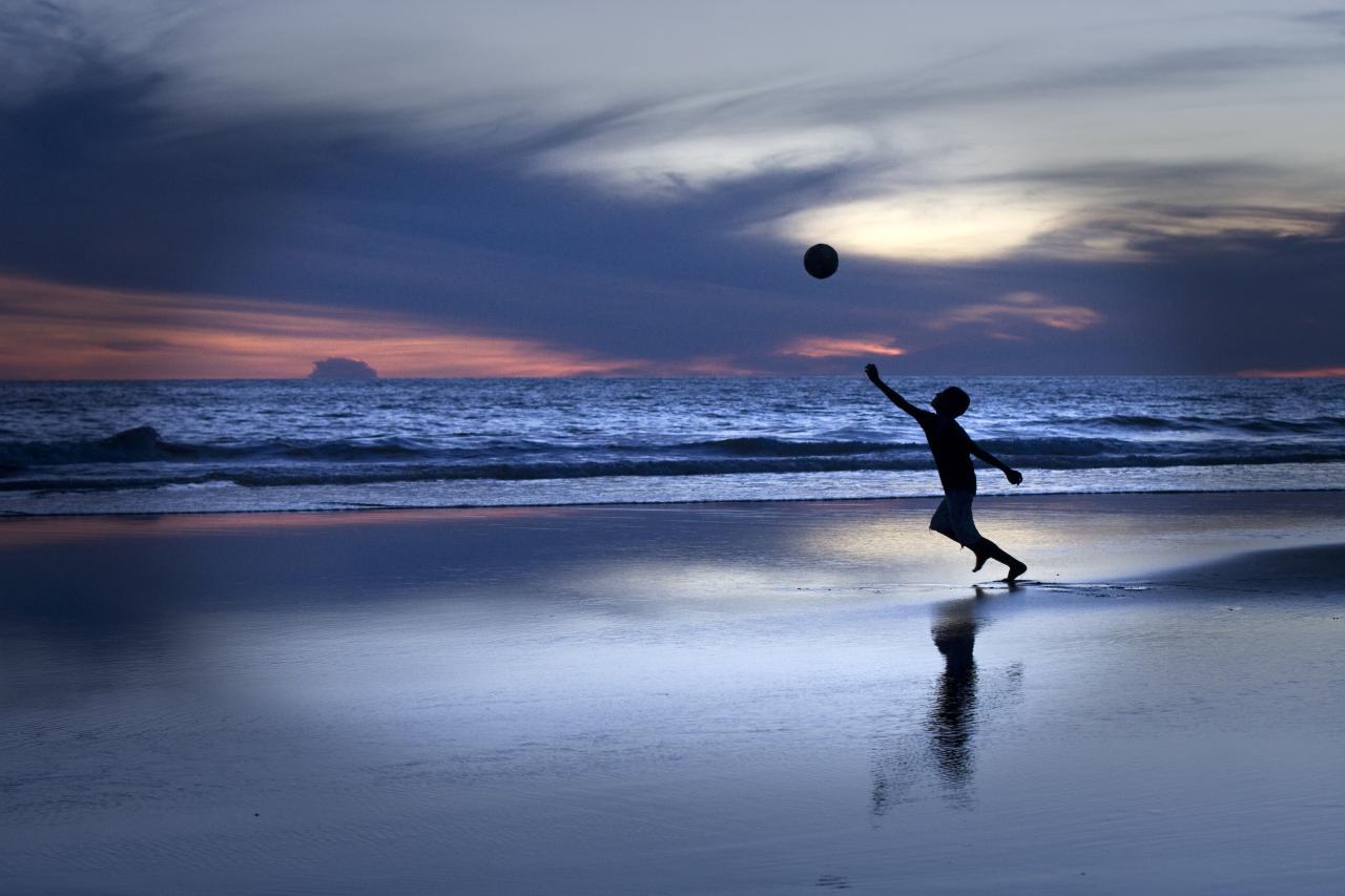 A boy plays on the beach in Guatemala. 