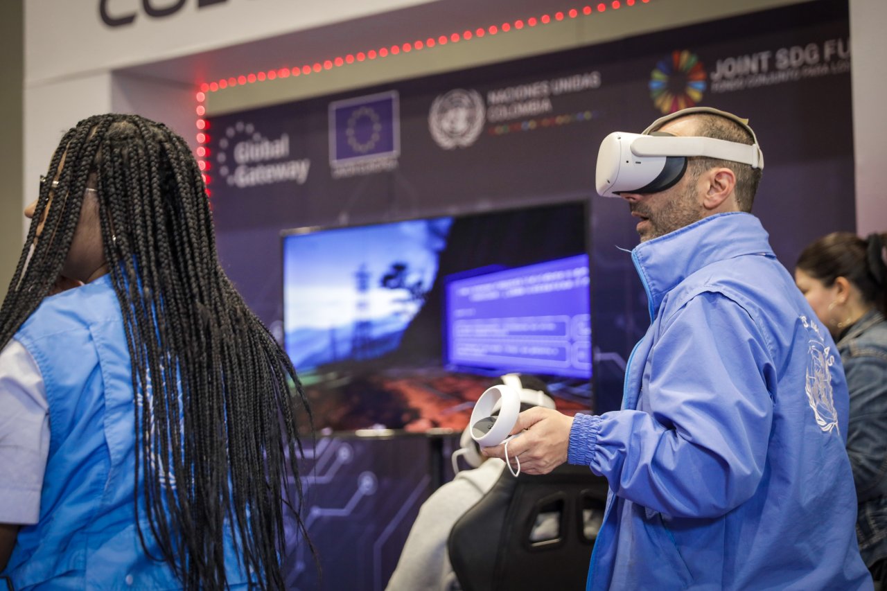 Participants at a youth conference in Colombia use virtual reality headsets.